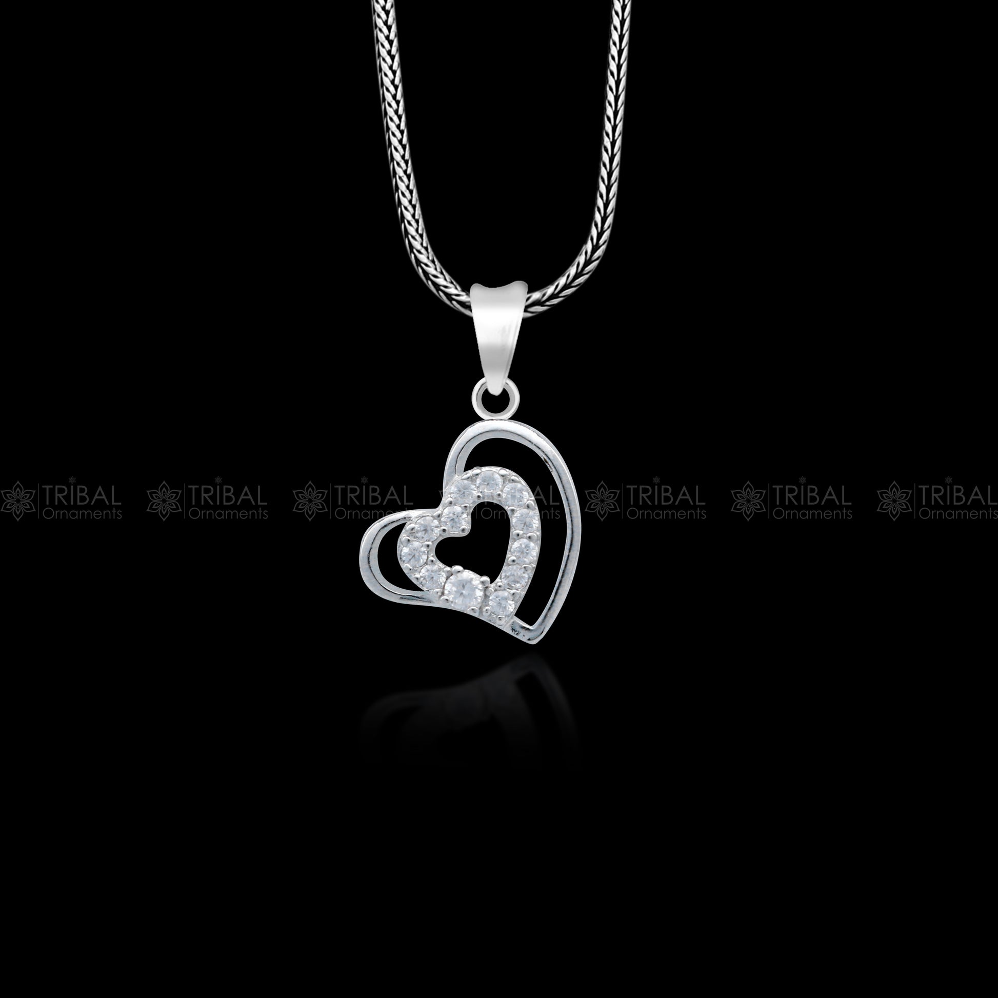 Handmade 925 sterling silver heart pendant with tribal design by TRIBAL ORNAMENTS, showcasing intricate craftsmanship.