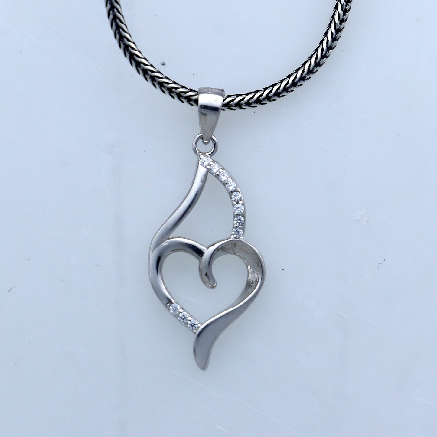 Handmade 925 sterling silver pendant with a heart design by TRIBAL ORNAMENTS, showcasing intricate tribal-inspired craftsmanship.
