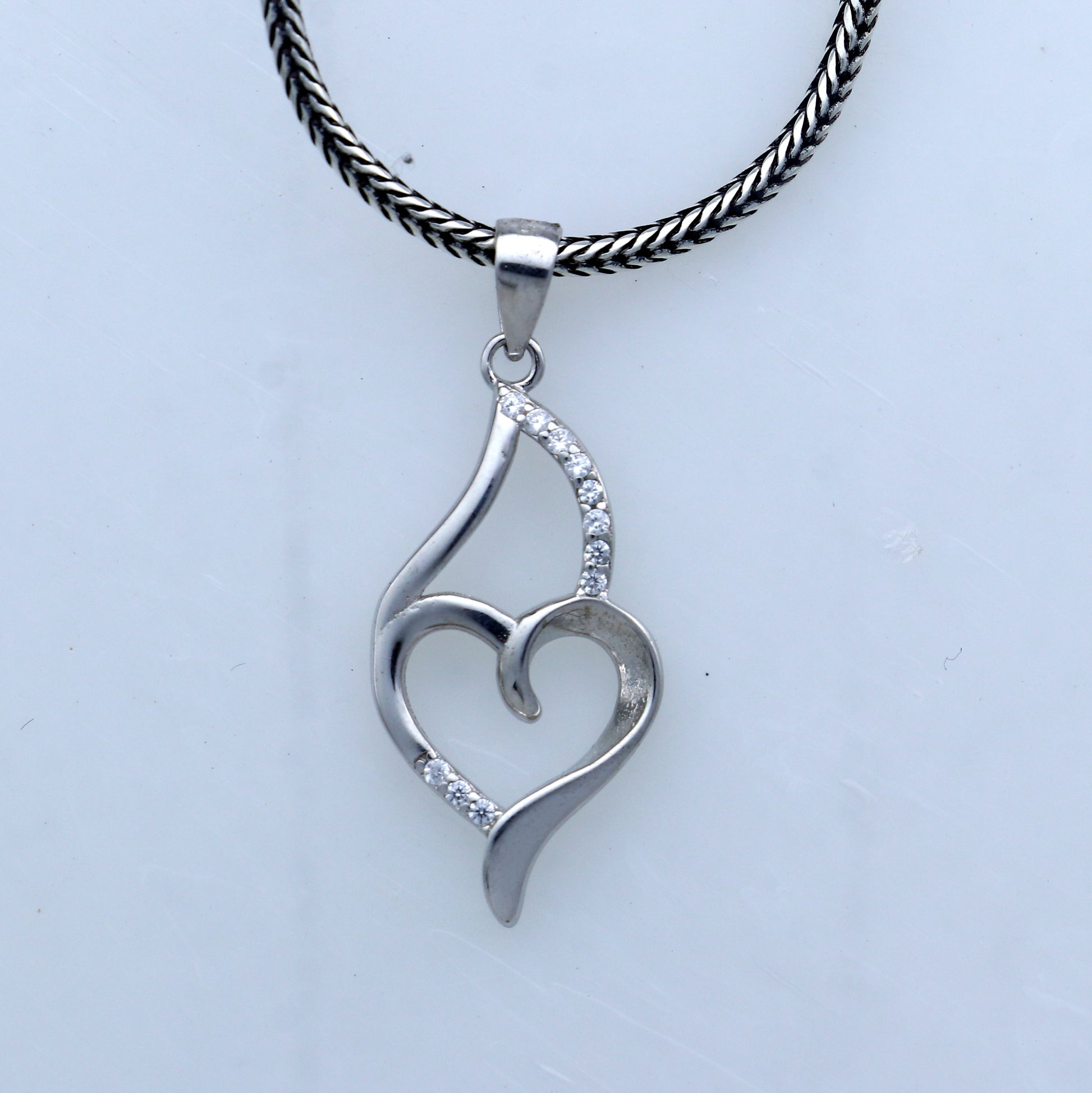 Handmade 925 sterling silver pendant with a heart design by TRIBAL ORNAMENTS, showcasing intricate tribal-inspired craftsmanship.