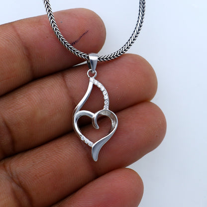 925 Sterling silver handmade heart pendant with tribal design, crafted by TRIBAL ORNAMENTS, featuring intricate detailing.