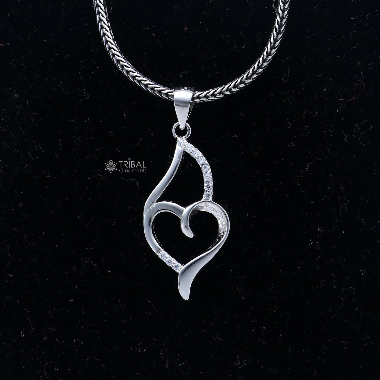 Handmade 925 Sterling silver heart pendant with tribal design from TRIBAL ORNAMENTS, featuring intricate craftsmanship.