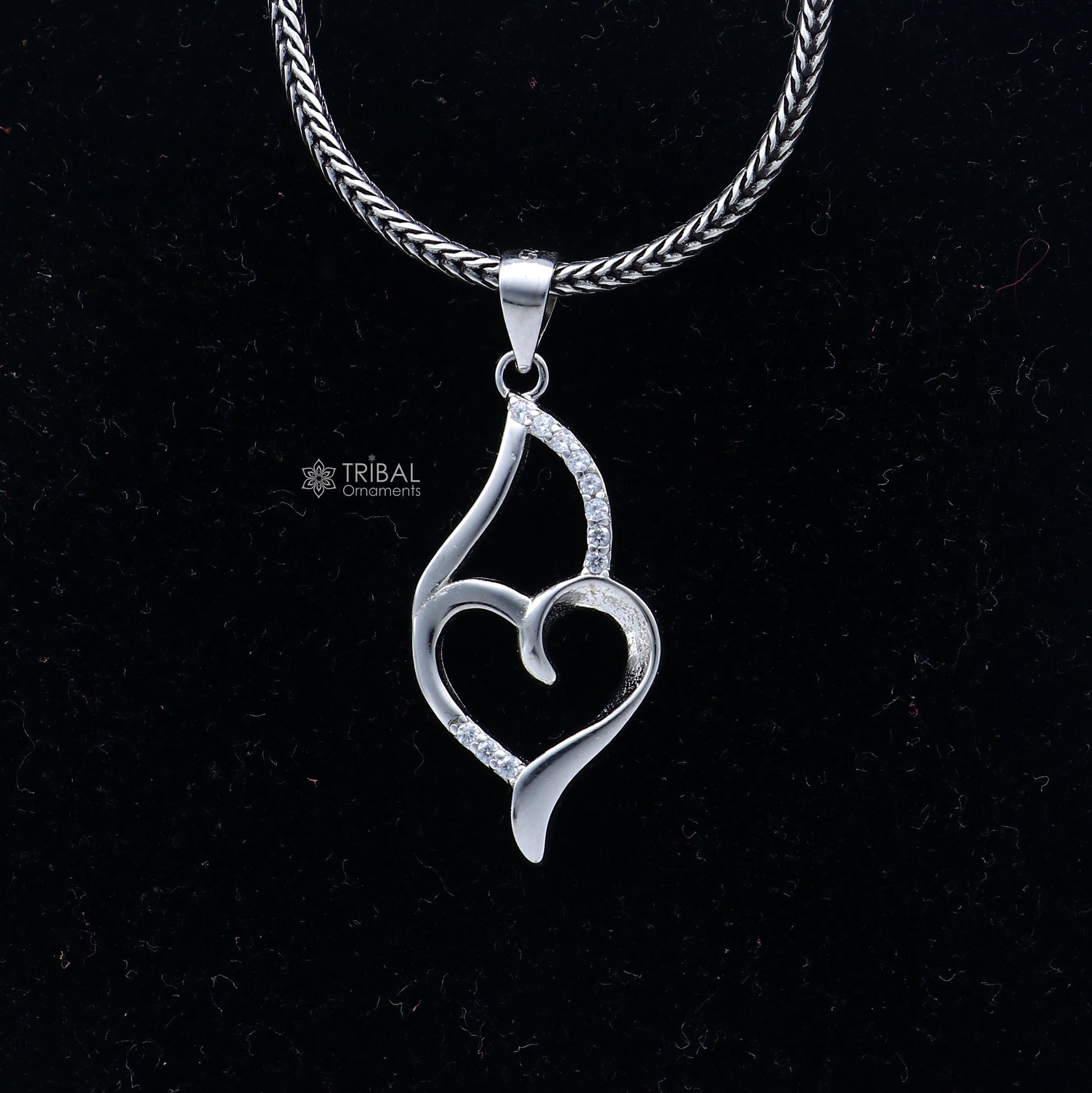 Handmade 925 Sterling silver heart pendant with tribal design from TRIBAL ORNAMENTS, featuring intricate craftsmanship.