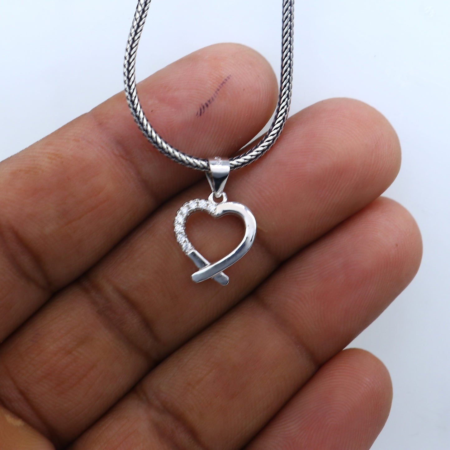 Sterling silver handmade heart pendant by TRIBAL ORNAMENTS, crafted with intricate tribal-inspired design.