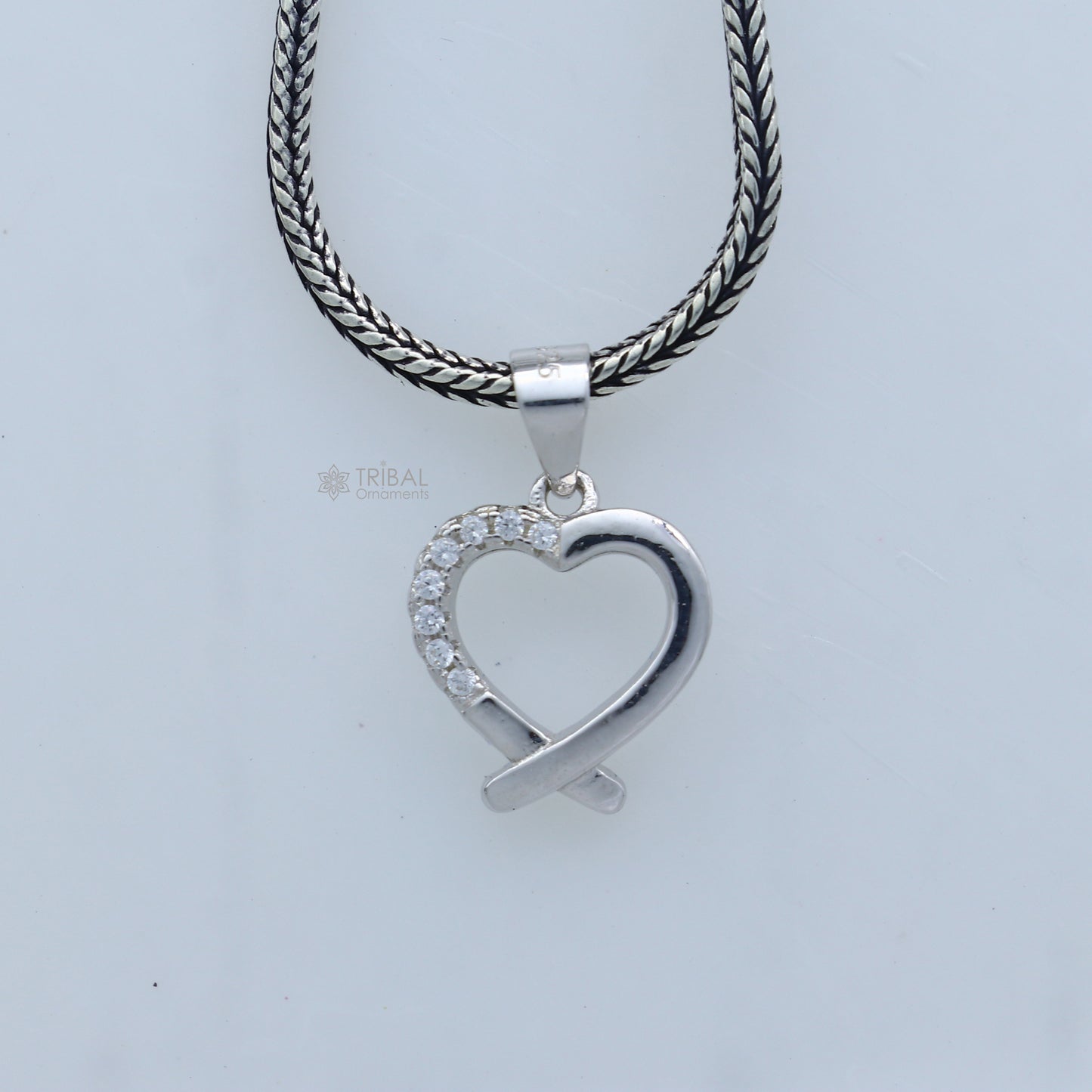 Handmade 925 sterling silver heart pendant by Tribal Ornaments featuring intricate tribal design.