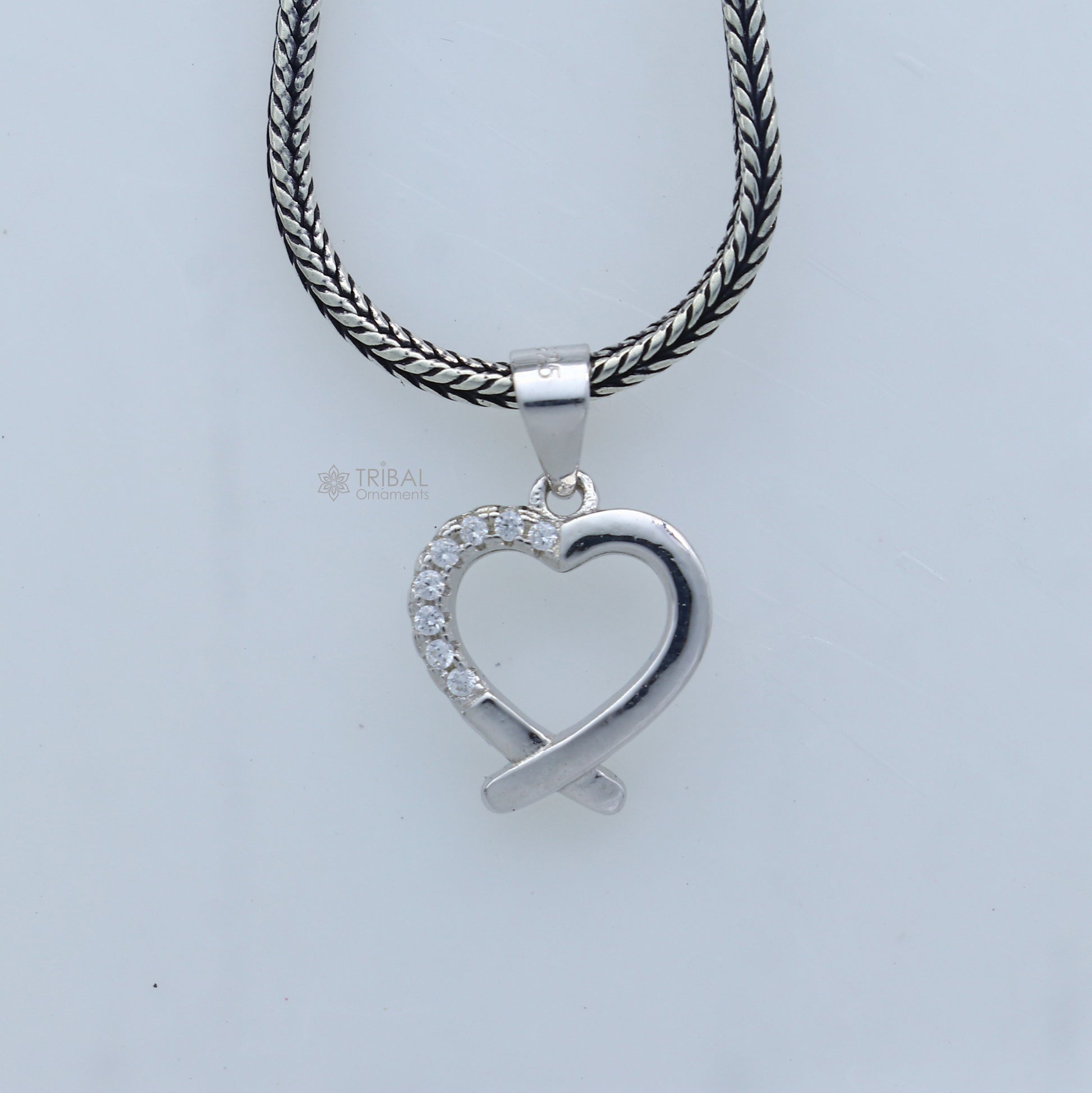 Handmade 925 sterling silver heart pendant by Tribal Ornaments featuring intricate tribal design.