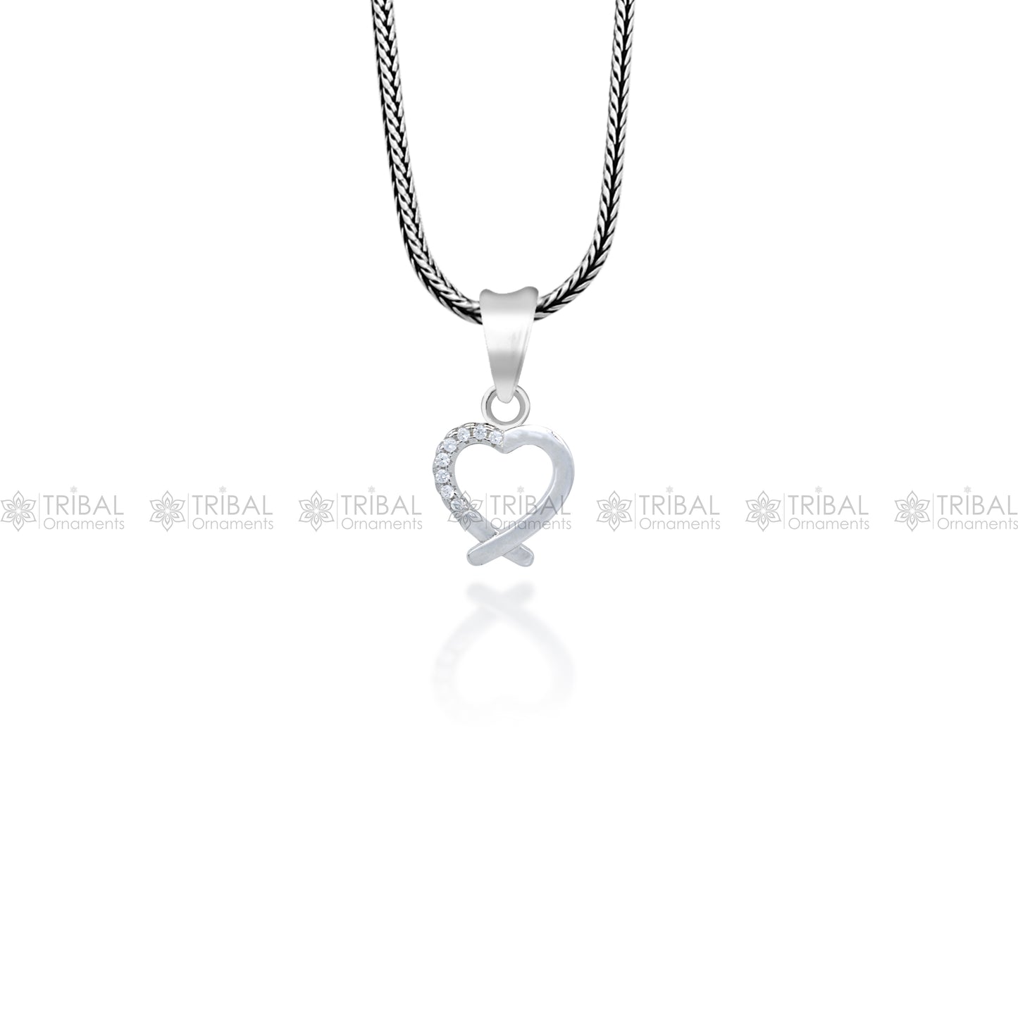 Handmade 925 sterling silver heart pendant with tribal design, crafted by TRIBAL ORNAMENTS, showcasing intricate silver craftsmanship.
