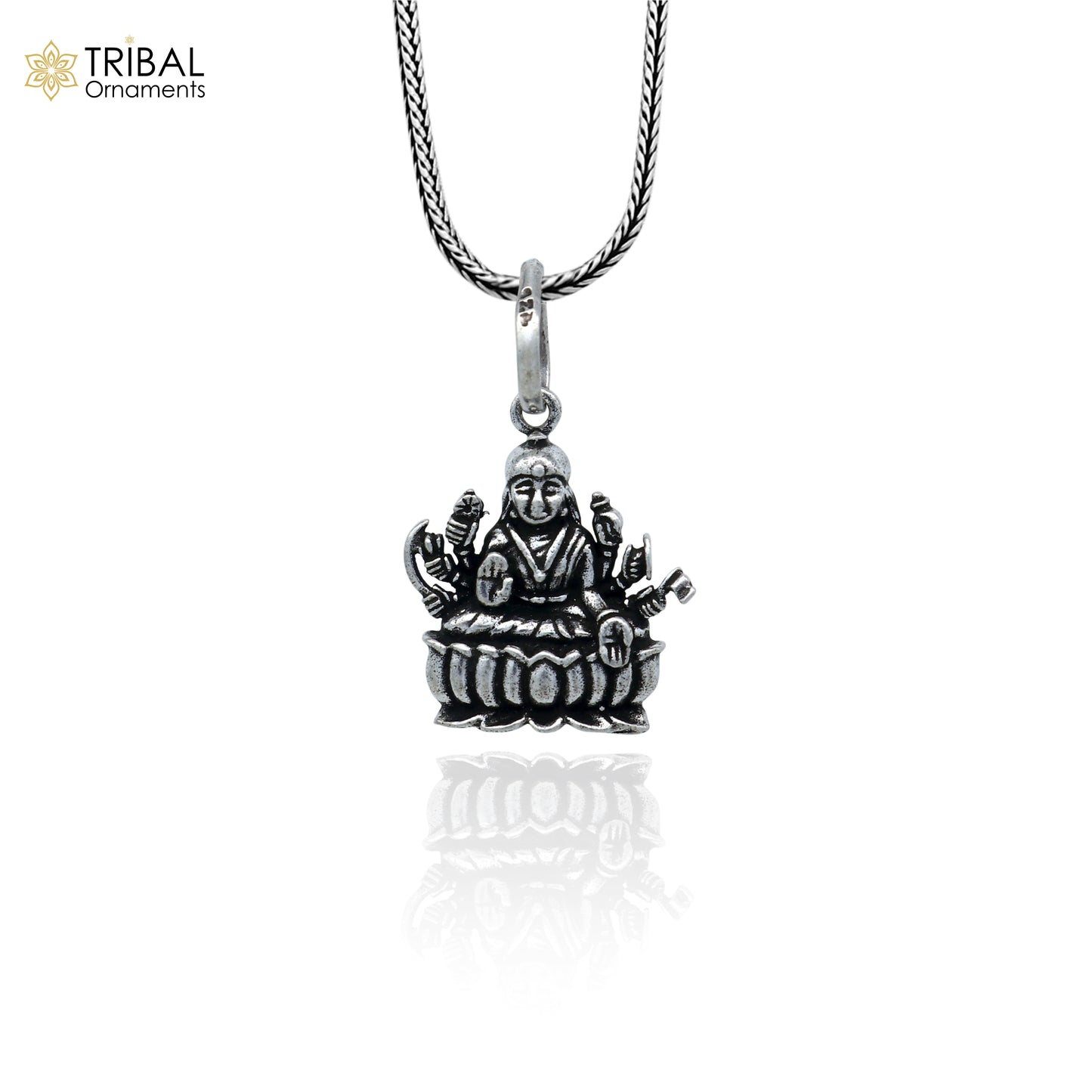 Sterling silver handmade Lord Dhan Laxmi pendant from TRIBAL ORNAMENTS featuring intricate design and stylish craftsmanship.