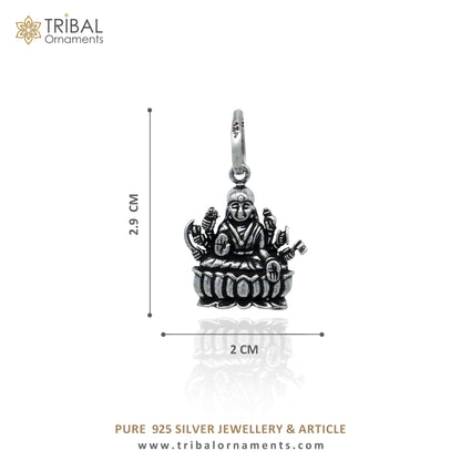 Sterling silver handmade Lord Dhan Laxmi ji pendant by TRIBAL ORNAMENTS, featuring intricate tribal design and stylish craftsmanship.