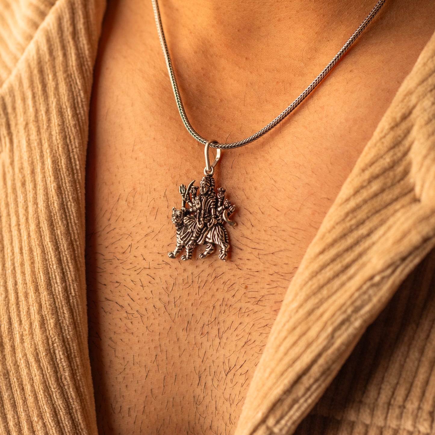 Sterling silver handmade Lord Durga Maa pendant, stylish tribal design by TRIBAL ORNAMENTS, featuring intricate craftsmanship.
