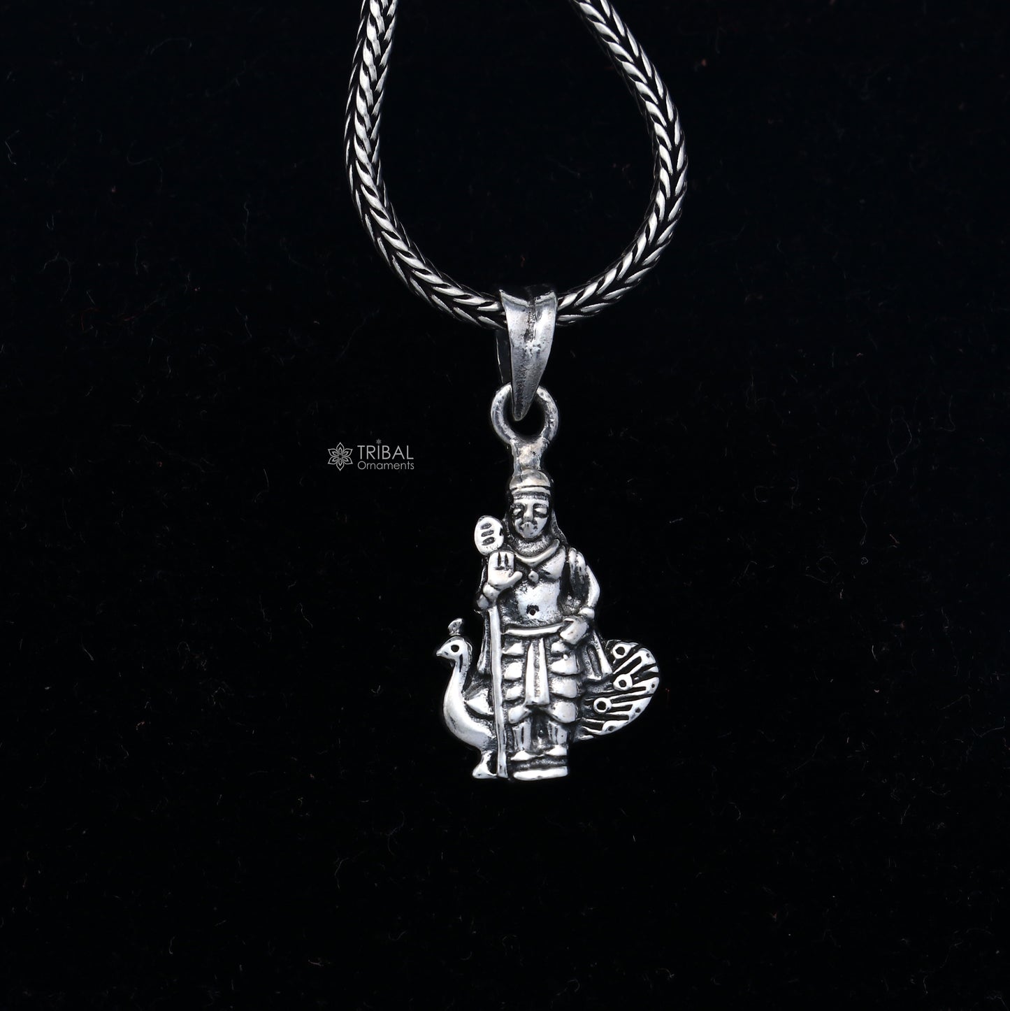 Handmade 925 Sterling silver Lord Kartikey pendant by Tribal Ornaments showing intricate tribal design and detailed craftsmanship.