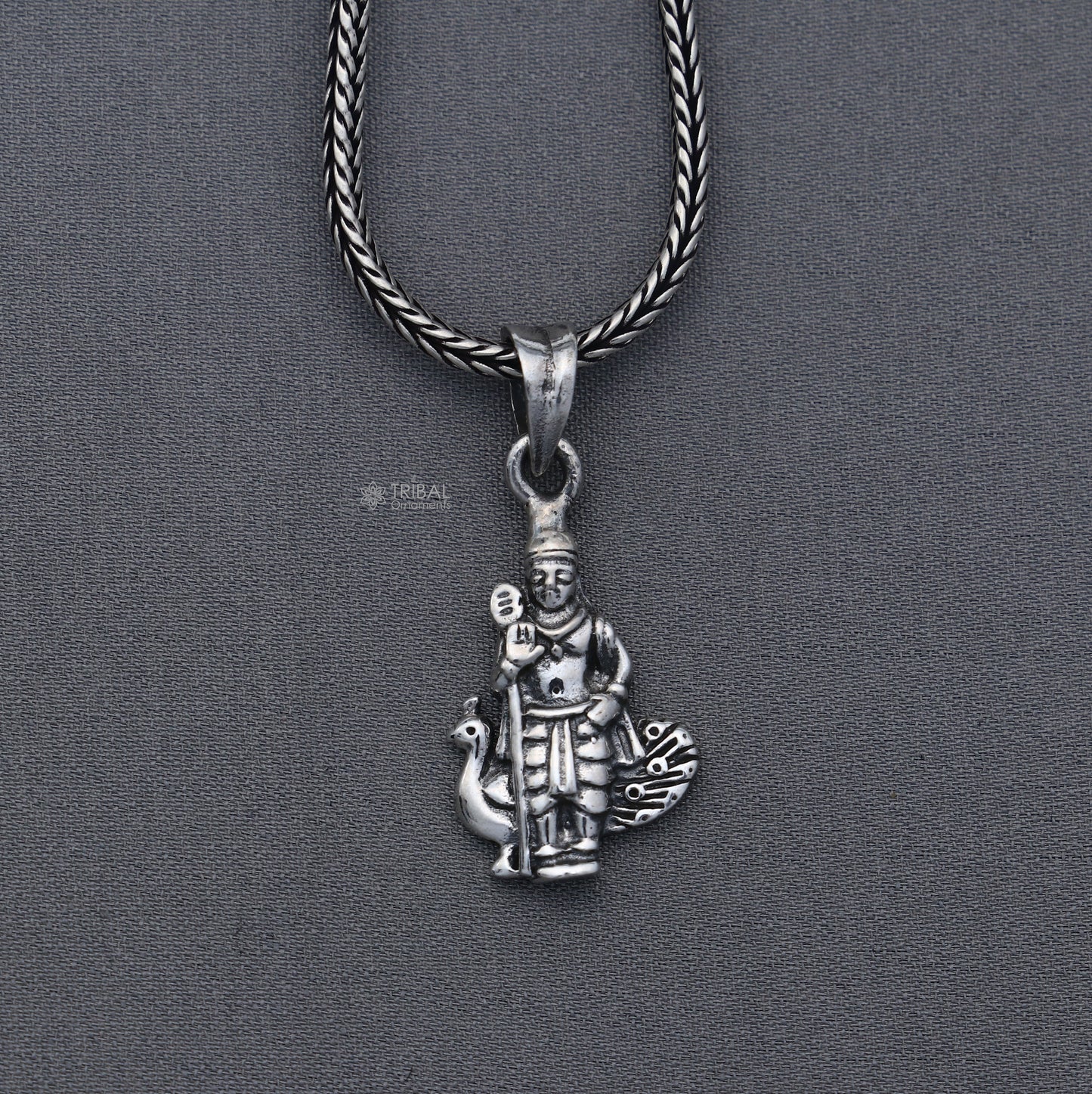 Handmade 925 Sterling silver Lord Kartikey pendant by Tribal Ornaments featuring intricate tribal design.