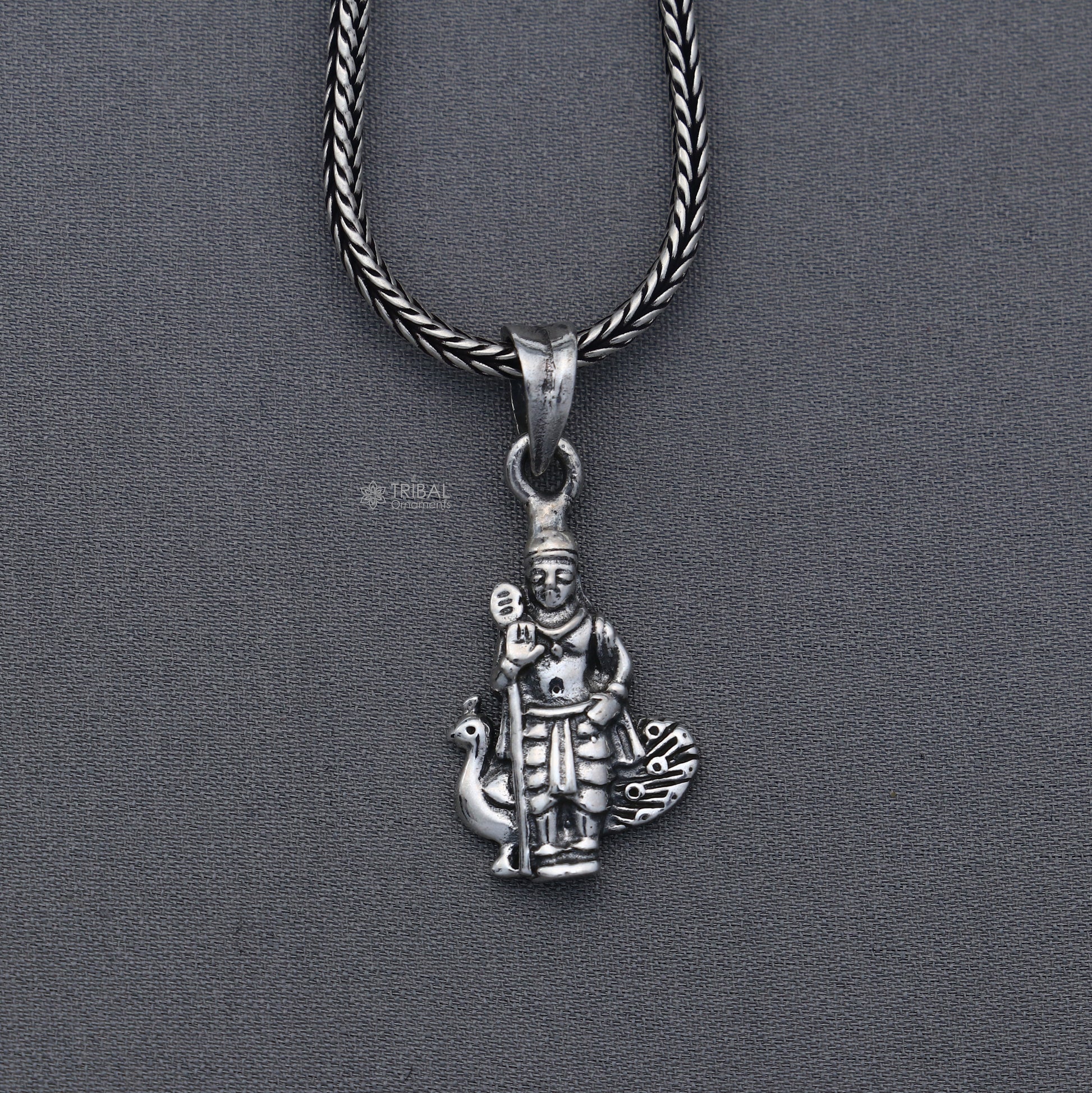 Handmade 925 Sterling silver Lord Kartikey pendant by Tribal Ornaments featuring intricate tribal design.