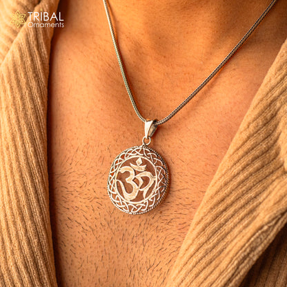 Sterling silver 'Aum' OM pendant by TRIBAL ORNAMENTS, unisex handmade jewelry featuring spiritual mantra symbol.