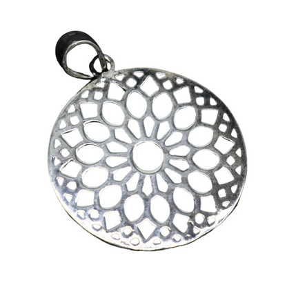 Sterling silver tribal pendant with a round floral design, handmade jewelry from India, perfect for gifting.