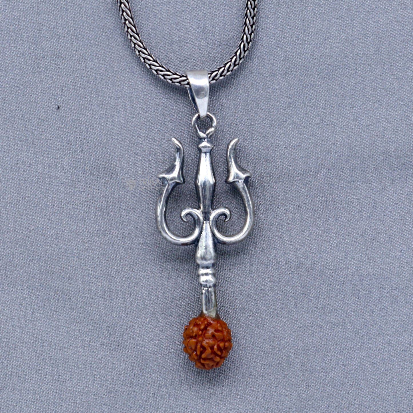 925 Sterling silver handmade Trishul pendant with Rudraksha bead, crafted by TRIBAL ORNAMENTS, featuring a detailed trident design.