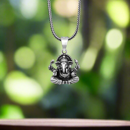 925 Sterling silver Lord Ganesha pendant with unique tribal design, handmade by TRIBAL ORNAMENTS, detailed religious jewelry.