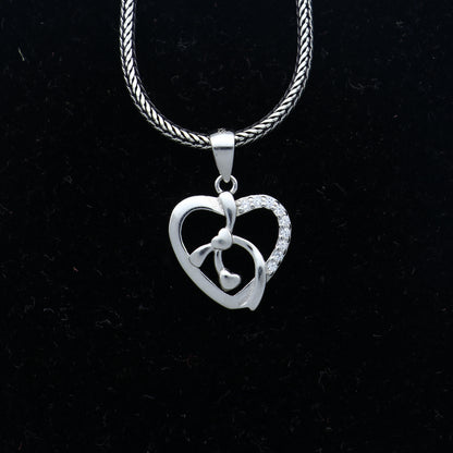 925 Sterling silver heart-shaped diamond pendant by TRIBAL ORNAMENTS featuring intricate tribal design and sparkling diamonds.