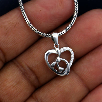 925 Sterling silver heart-shaped diamond pendant by TRIBAL ORNAMENTS, featuring a delicate heart design with sparkling diamonds.