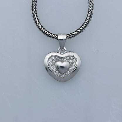 925 Sterling silver heart-shaped diamond pendant from TRIBAL ORNAMENTS, featuring intricate tribal design and sparkling diamonds.