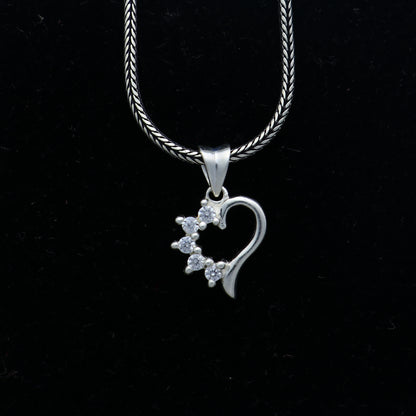 925 Sterling silver heart design diamond pendant by TRIBAL ORNAMENTS featuring a delicate heart shape and sparkling diamonds.