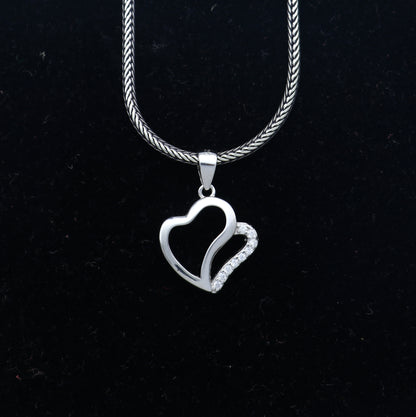 925 Sterling silver heart-shaped diamond pendant from TRIBAL ORNAMENTS, showcasing a detailed heart design with sparkling diamonds.