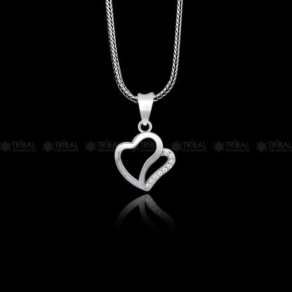 925 Sterling silver heart-shaped diamond pendant by TRIBAL ORNAMENTS featuring intricate tribal design and sparkling diamonds.