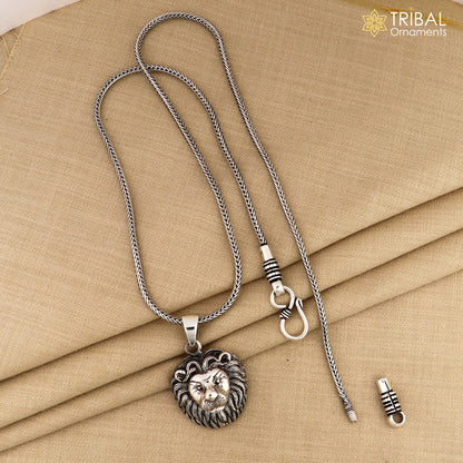 Sterling silver lion face pendant with chain, tribal jewelry by TRIBAL ORNAMENTS, showcasing intricate tribal design.