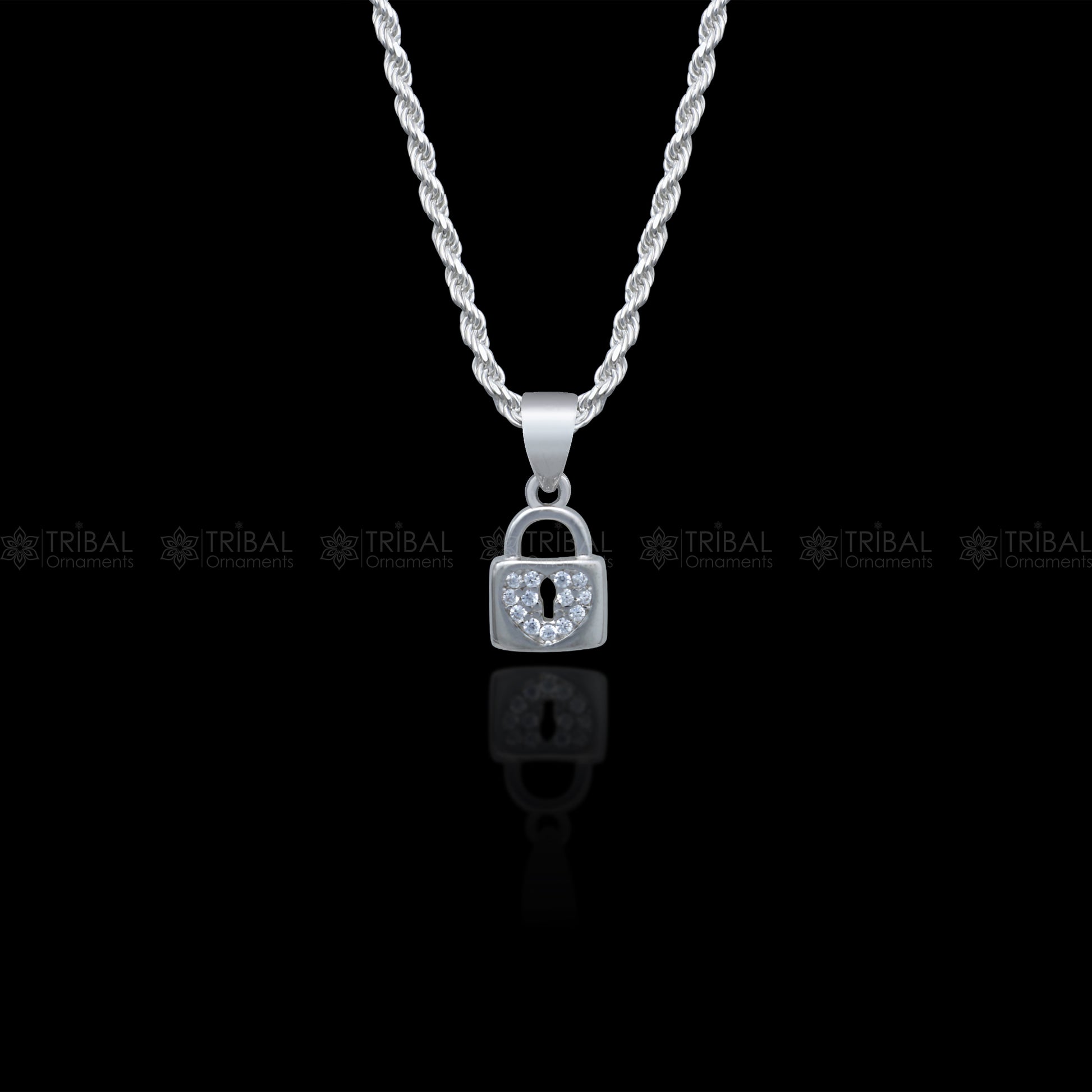 Sterling silver pendant with a lock shape featuring diamond cubic zirconia stones by Tribal Ornaments.