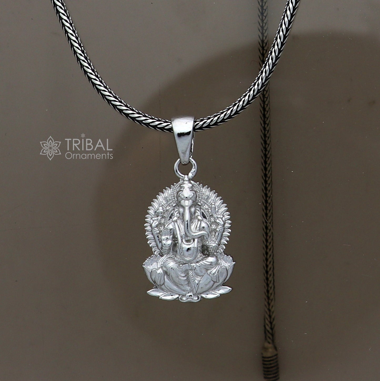 Sterling silver Lord Ganesha pendant with kamalasan design, handmade unisex jewelry from Tribal Ornaments.