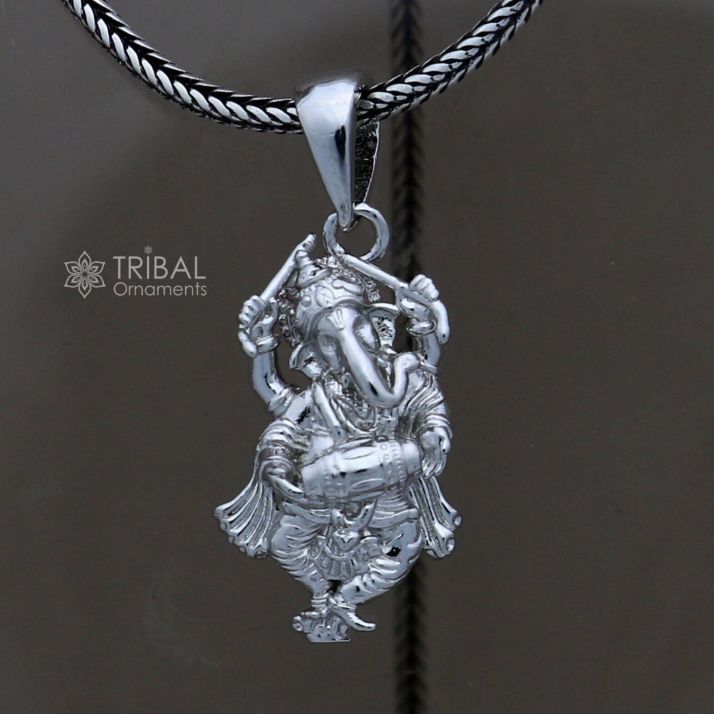 Sterling silver Lord Ganesha dancing pendant, unisex handmade jewelry by TRIBAL ORNAMENTS, detailed traditional design.