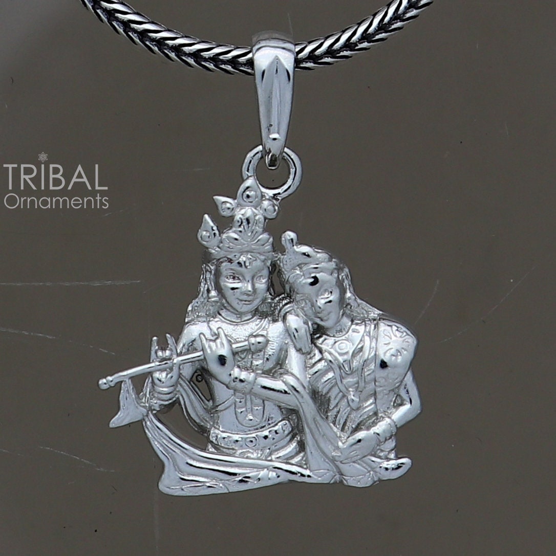 925 sterling silver Lord Krishna and Radha pendant featuring divine tribal jewelry design with intricate craftsmanship.