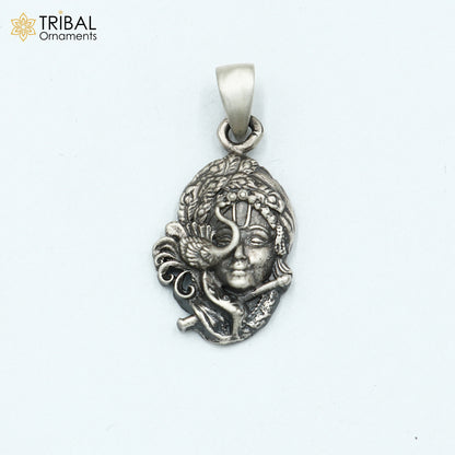 925 sterling silver Lord Krishna pendant from tribal jewelry collection, featuring intricate tribal design and craftsmanship.