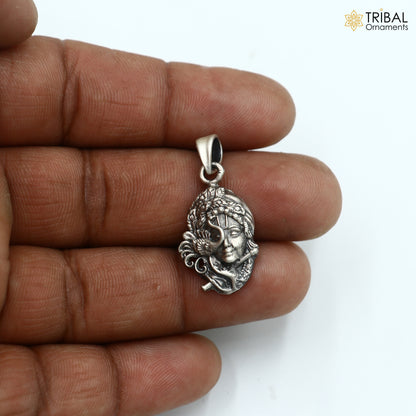 925 sterling silver Lord Krishna pendant from tribal jewelry collection, featuring detailed tribal design and craftsmanship.