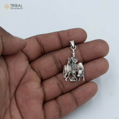 925 sterling silver Lord Krishna with cow pendant on chain, tribal jewelry design featuring intricate detailing and traditional craftsmanship.