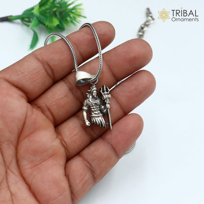 Sterling silver Lord Mahakal pendant with chain, tribal jewelry style, detailed tribal ornament design.