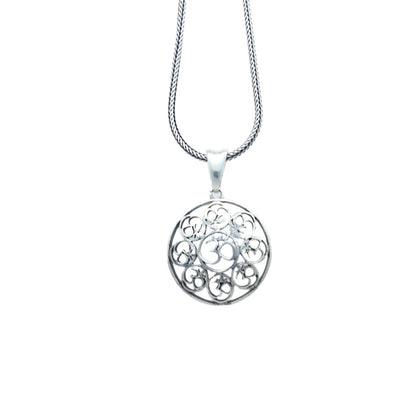 925 Sterling silver Om pendant featuring the Om mantra, crafted by TRIBAL ORNAMENTS with intricate detailing.