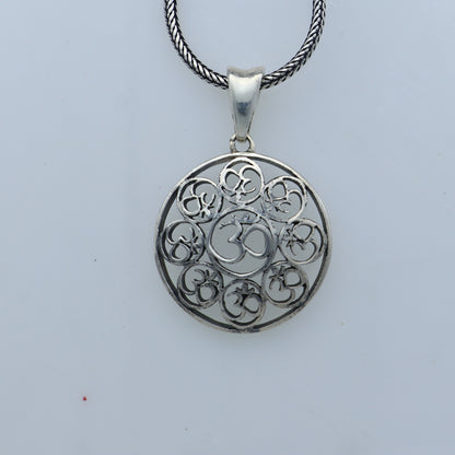 925 Sterling silver Om pendant featuring Om mantra design from Tribal Ornaments, showcasing intricate craftsmanship and religious symbolism.