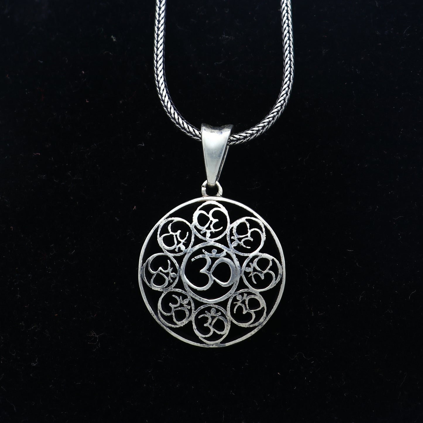 925 Sterling silver Om pendant featuring the Om mantra design, crafted by Tribal Ornaments, with intricate detailing.