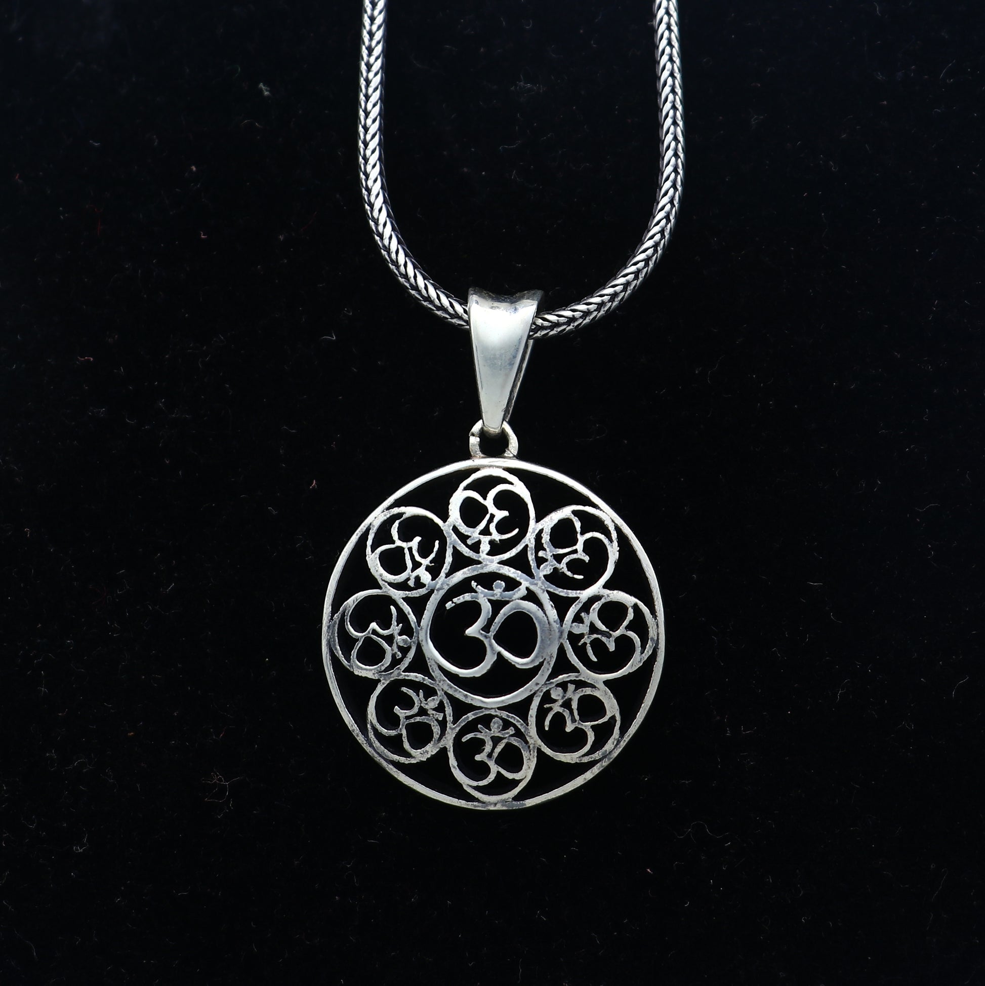 925 Sterling silver Om pendant featuring the Om mantra design, crafted by Tribal Ornaments, with intricate detailing.