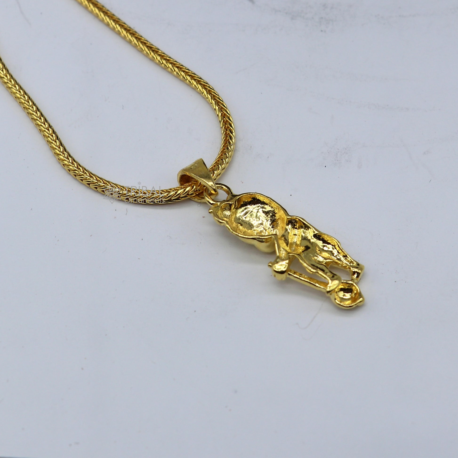 Sterling silver Lord Hanuman pendant with gold polish, handmade tribal ornament, featuring Lord Mugan or Kartikeya design.