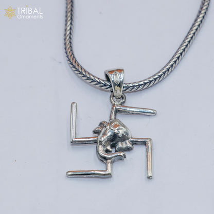 Sterling silver Swastik and Ganesha pendant with chain, tribal jewelry by TRIBAL ORNAMENTS, showcasing intricate design details.