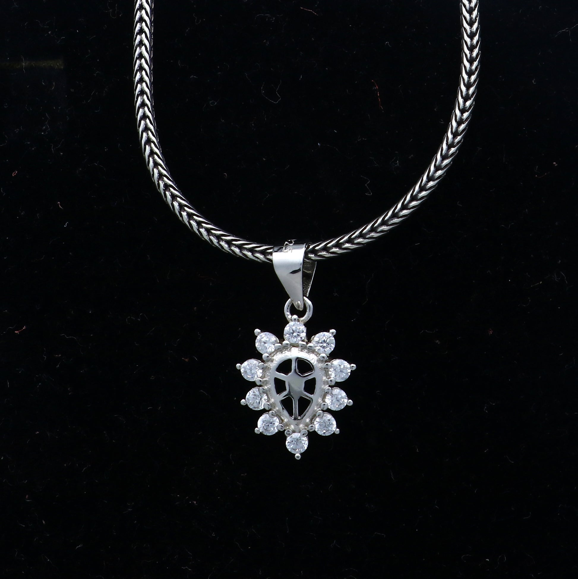 925 Sterling silver diamond pendant with unique tribal design, crafted by TRIBAL ORNAMENTS, featuring intricate details and sparkling diamonds.