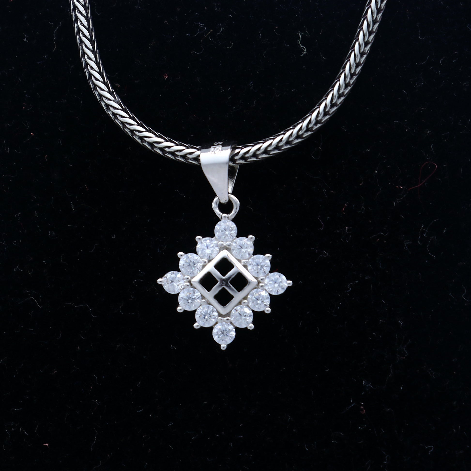 925 Sterling silver diamond pendant with unique tribal design, crafted by TRIBAL ORNAMENTS, featuring intricate detailing.