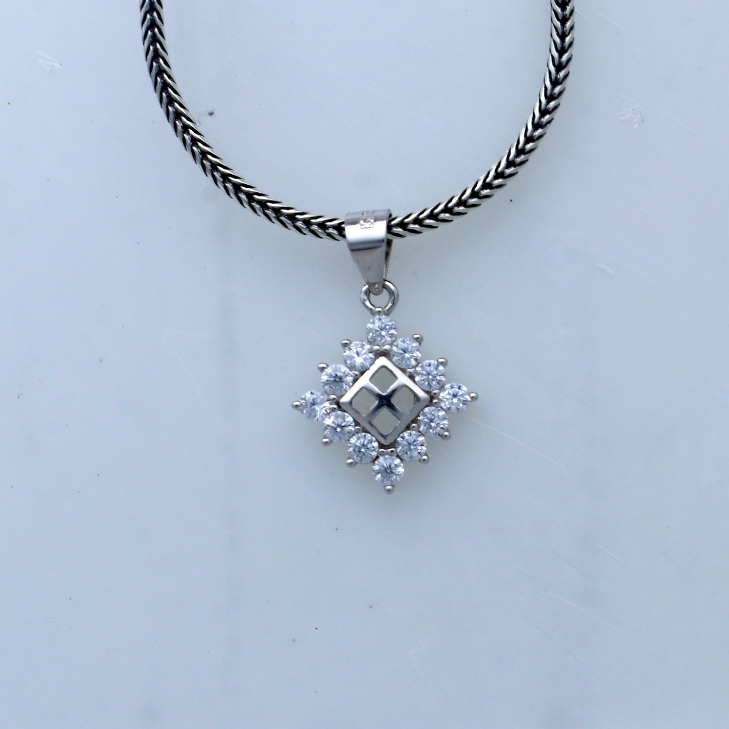 925 Sterling silver diamond pendant with unique tribal design from TRIBAL ORNAMENTS, showcasing intricate craftsmanship and sparkling diamonds.