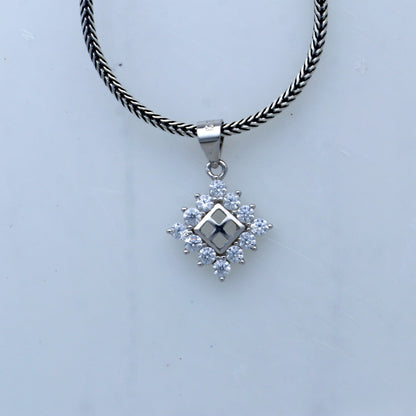 925 Sterling silver diamond pendant with unique tribal design from TRIBAL ORNAMENTS, showcasing intricate craftsmanship and sparkling diamonds.