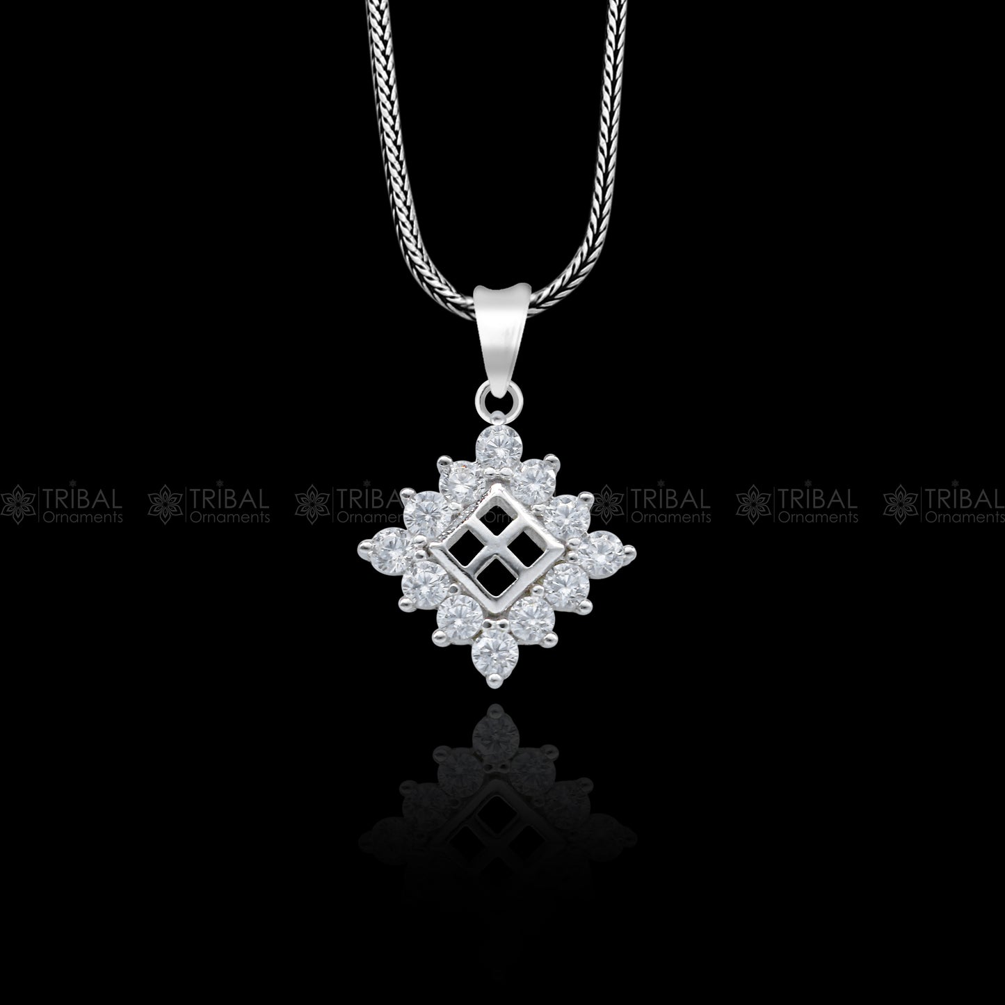 925 Sterling silver diamond pendant with unique tribal design from TRIBAL ORNAMENTS, featuring intricate craftsmanship and sparkling accents.