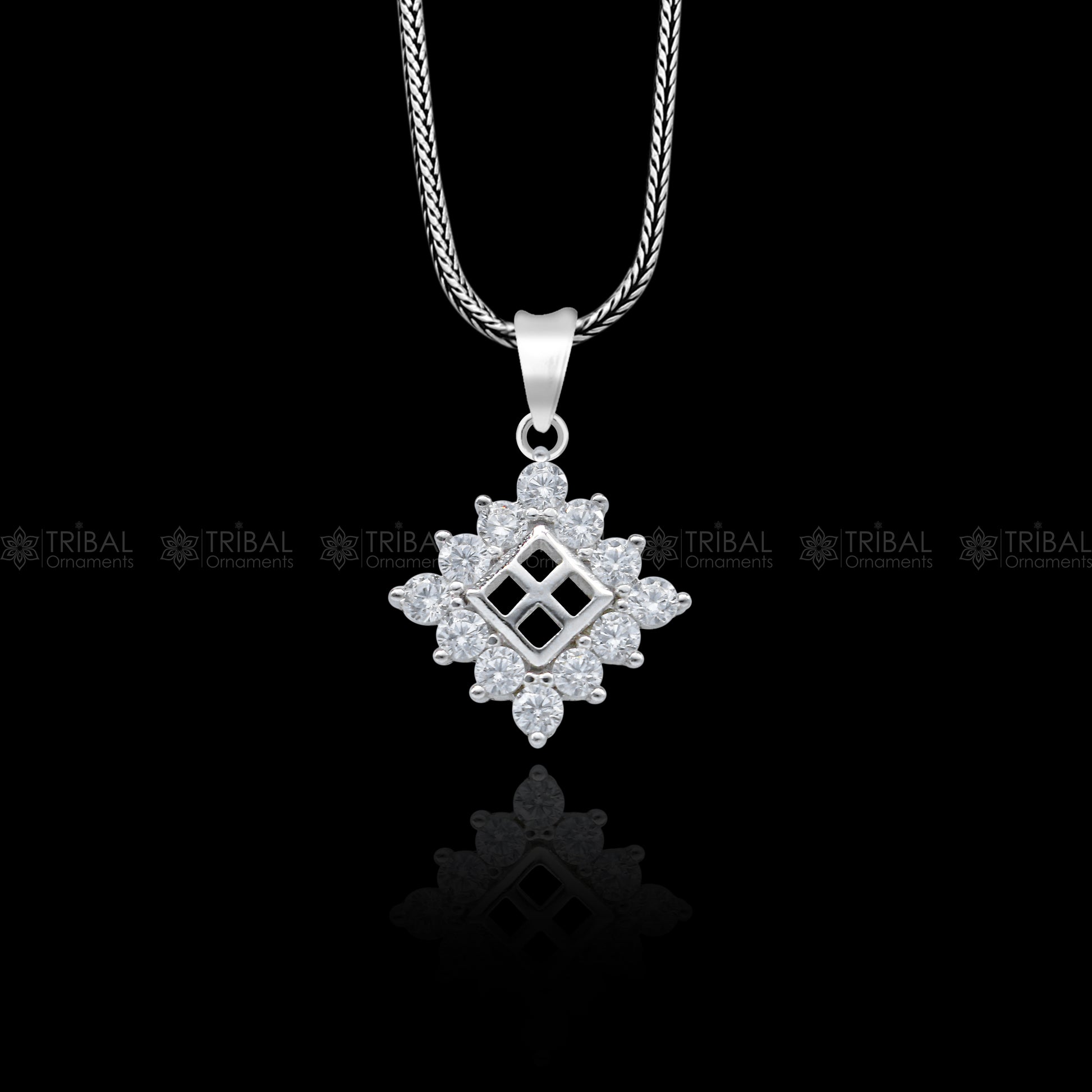 925 Sterling silver diamond pendant with unique tribal design from TRIBAL ORNAMENTS, featuring intricate craftsmanship and sparkling accents.