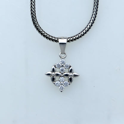 925 Sterling silver unique diamond pendant by TRIBAL ORNAMENTS featuring intricate tribal design and sparkling diamonds.