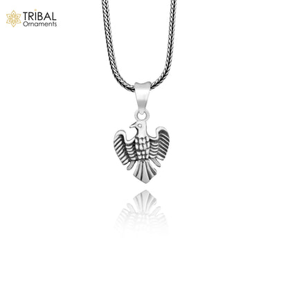 Sterling silver bird pendant by TRIBAL ORNAMENTS, handmade dove design symbolizing peace, love, and purity.