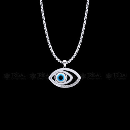 Pure 925 sterling silver evil eyes pendant with CZ stone from TRIBAL ORNAMENTS, featuring detailed tribal design and sparkling gemstone.